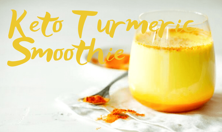 Glass of turmeric shake with powder on table