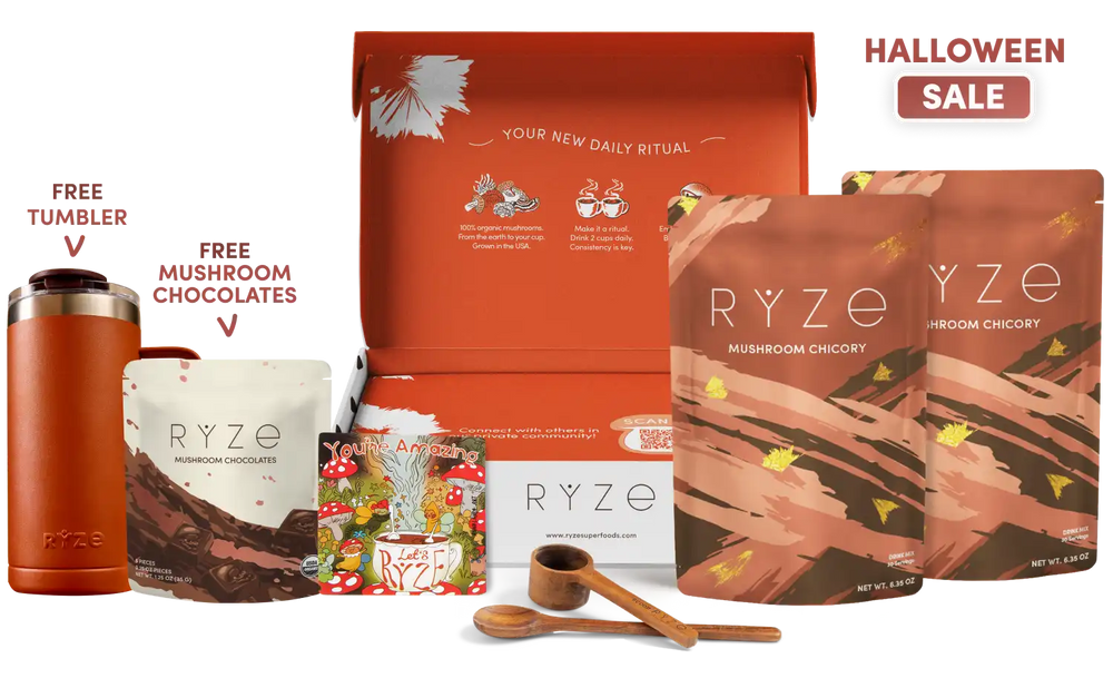 A RYZE 'Your New Daily Ritual' gift set displayed on a white background with promotional text. The set includes a large orange box, two brown 'Mushroom Chicory' pouches, a free tumbler, and free mushroom chocolates, along with wooden measuring tools.